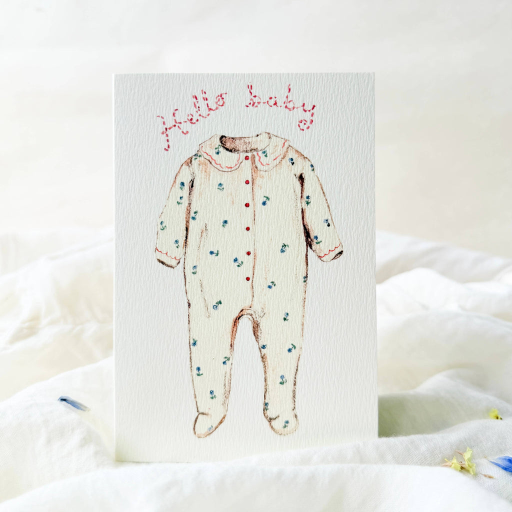 Baby onesie with floral pattern on a white background