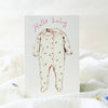 Baby onesie with floral pattern on a white background