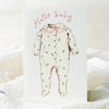 Illustration of a baby onesie with 'Hello baby' text on a white background