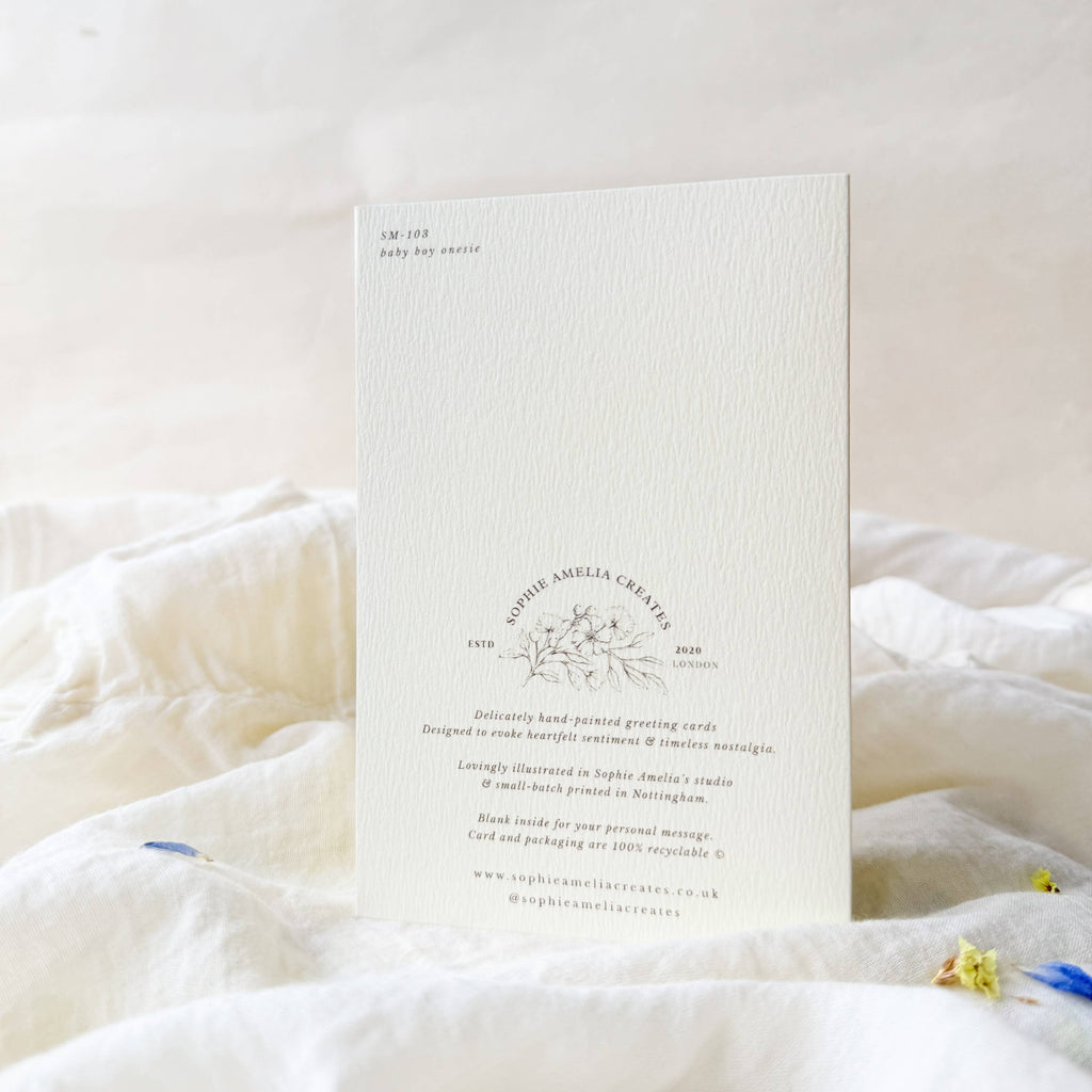 White card with text and design on a white surface