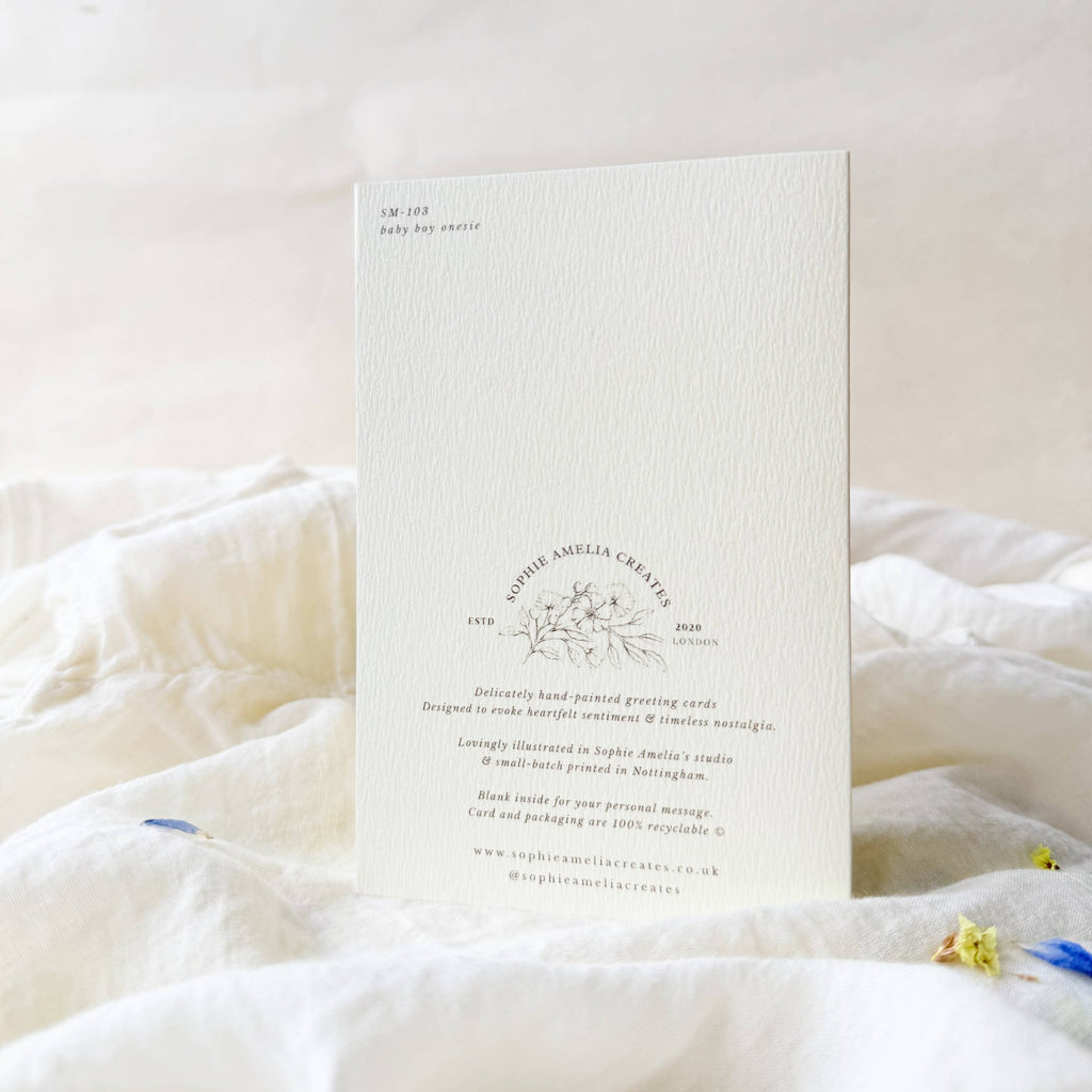 White card with text and design on a white surface