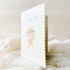 Greeting card with floral design and text on a white fabric background