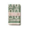 Pack of tea towels with green floral pattern on a white background