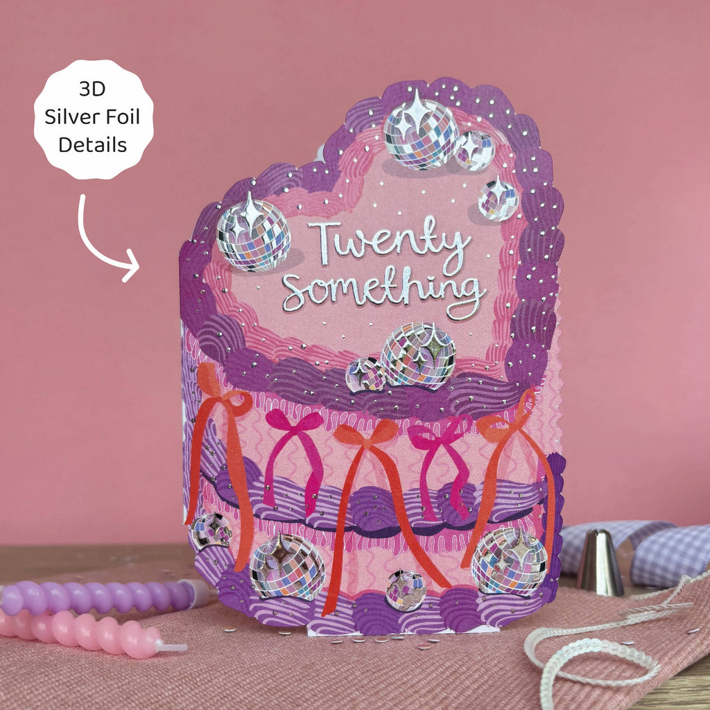 Decorative card with 'Twenty Something' text and silver foil details on a pink background