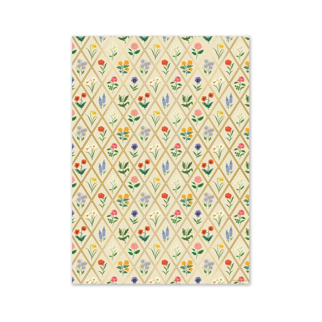 Patterned paper with colorful floral design on a beige background