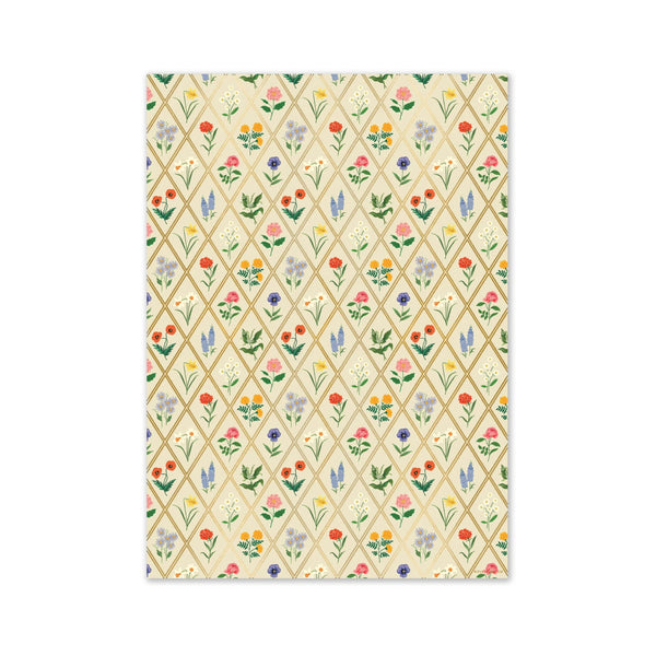 Patterned paper with colorful floral design on a beige background