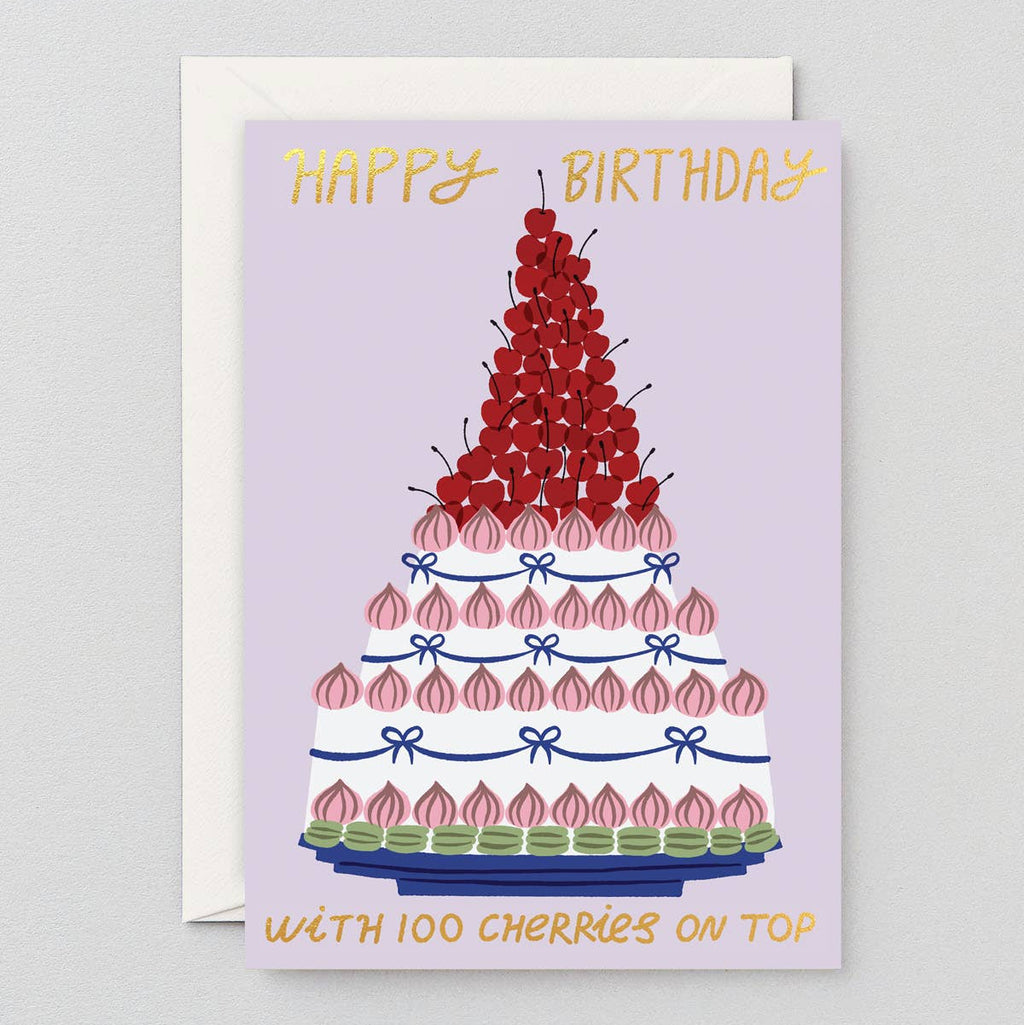 Birthday card with a cake illustration and cherry details on a light purple background