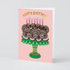 Birthday card with a cake illustration and 'Happy Birthday' text on a pink background