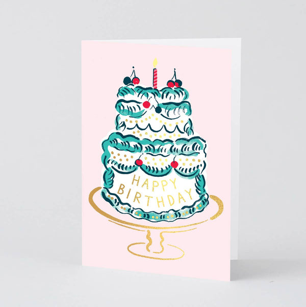 Greeting card with a birthday cake illustration on a light pink background