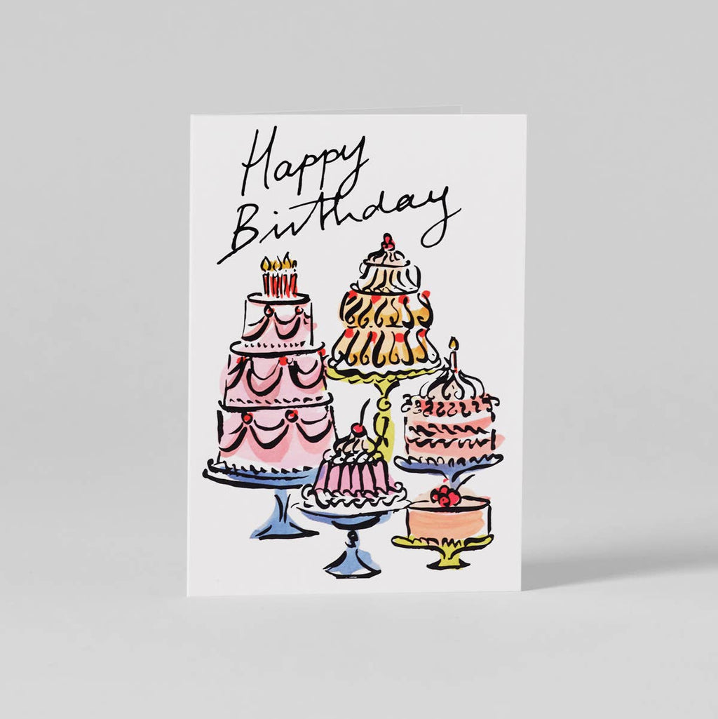 Greeting card with illustrations of birthday cakes and 'Happy Birthday' text on a white background.
