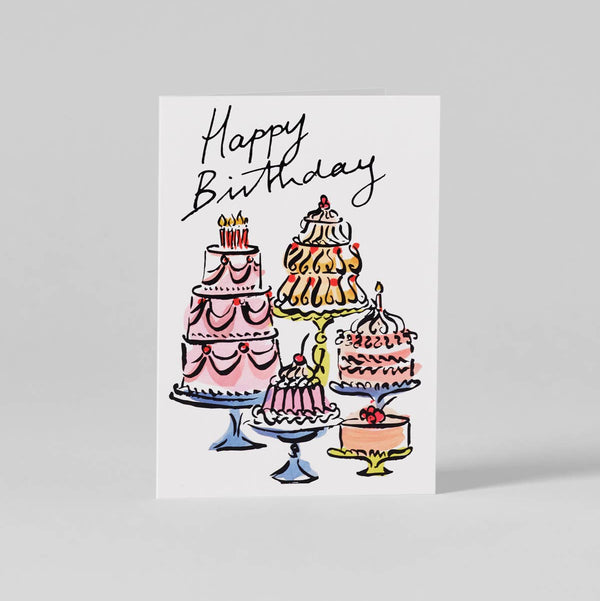 Greeting card with illustrations of birthday cakes and 'Happy Birthday' text on a white background.
