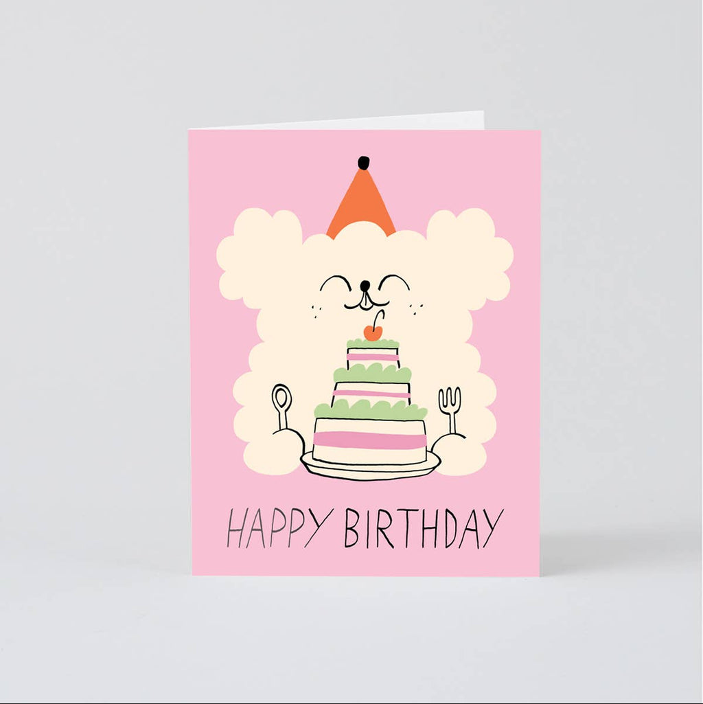 Birthday card with a cartoon dog and cake on a pink background