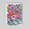 Colorful floral card with 'Thank You' text on a gray background