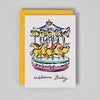 Greeting card with a colorful carousel illustration and 'Welcome Baby' text on a gray background