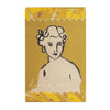 Soap packaging with a stylized illustration of a woman on a yellow background