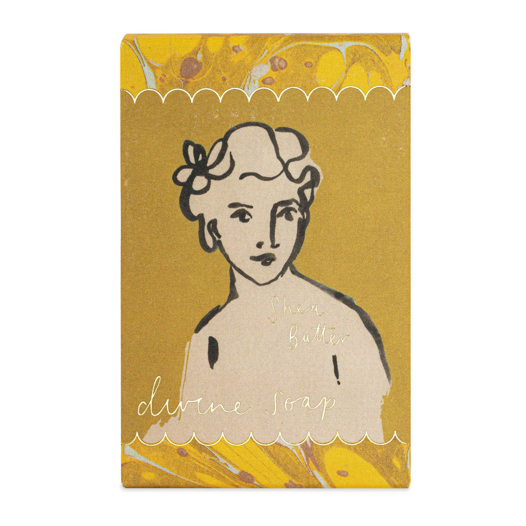 Soap packaging with a stylized illustration of a woman on a yellow background