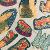 Vintage-style Christmas decorations with reindeer, trees, and sleighs on a textured background.