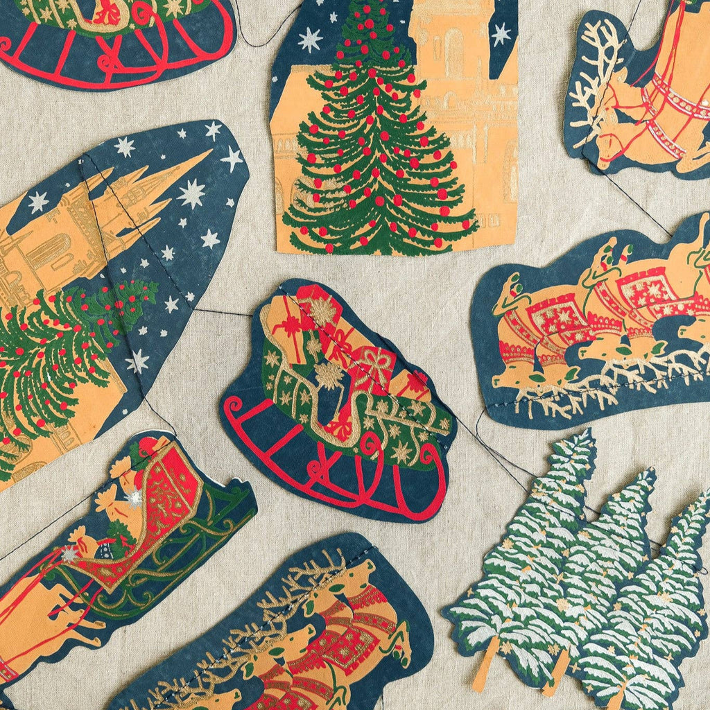Vintage-style Christmas decorations with reindeer, trees, and sleighs on a textured background.
