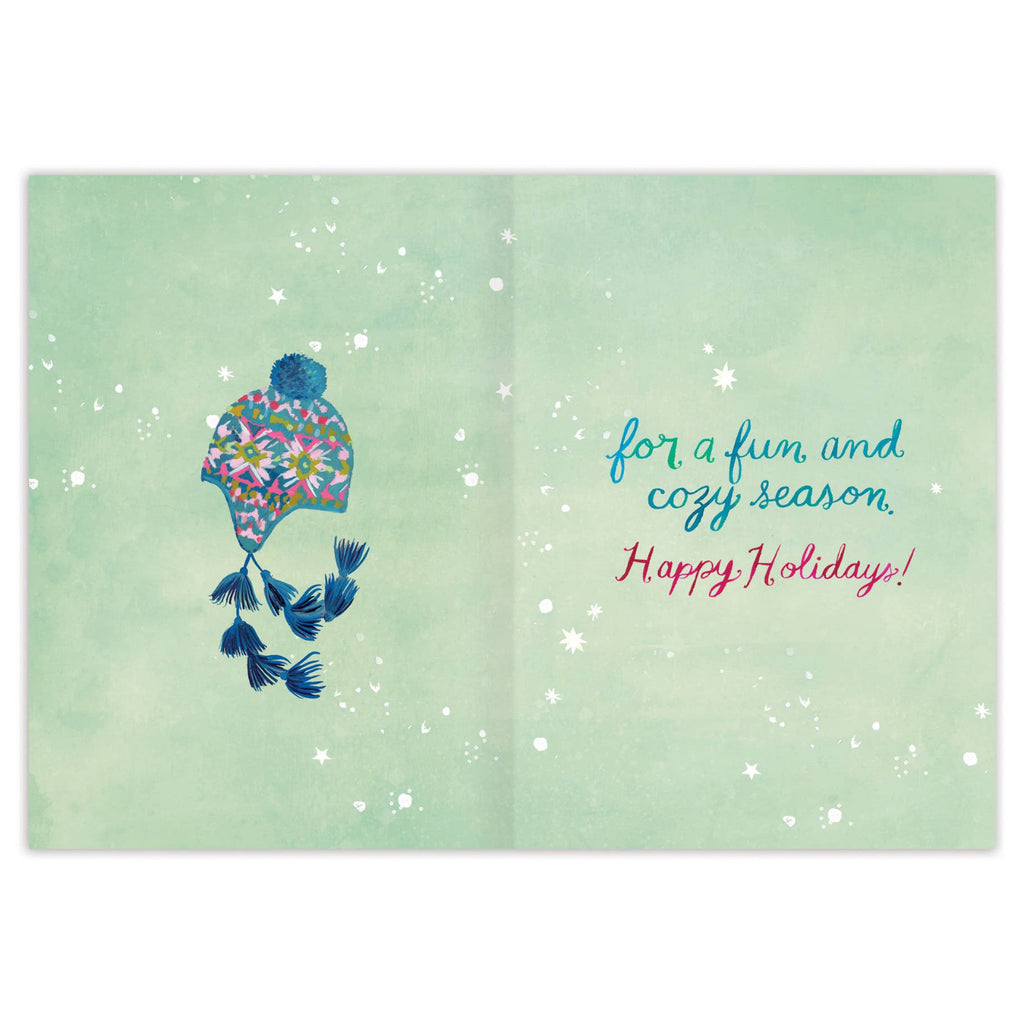 Holiday card with a floral hat and birds on a light green background