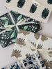 Gift boxes with floral patterns on a white background
