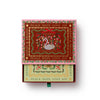 Decorative box with Christmas-themed design and text on a white background