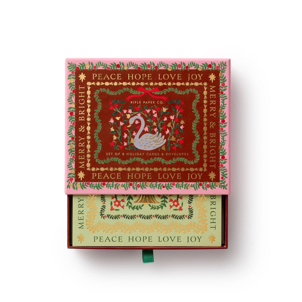Decorative box with Christmas-themed design and text on a white background