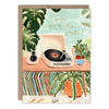 Greeting card with a record player and plants on a table, featuring the text 'you're one of the greats!'.