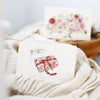 White towel with a decorative label on a white background