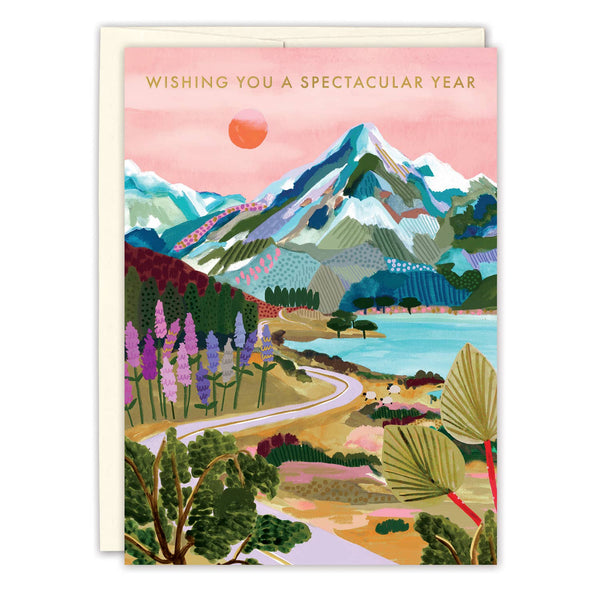 Greeting card with a scenic illustration of mountains, trees, and flowers with text 'Wishing You a Spectacular Year'.