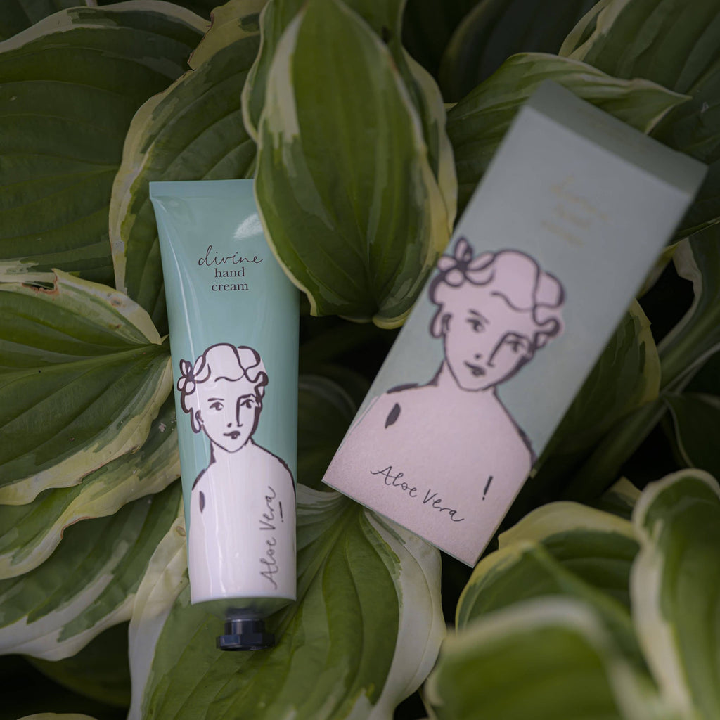 Hand cream tube and packaging with 'Aloe Vera' text on green leaves