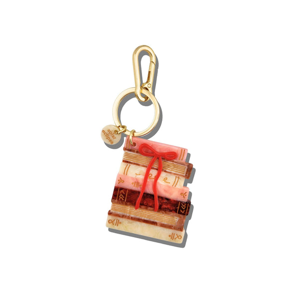 Keychain with a design of stacked books on a white background