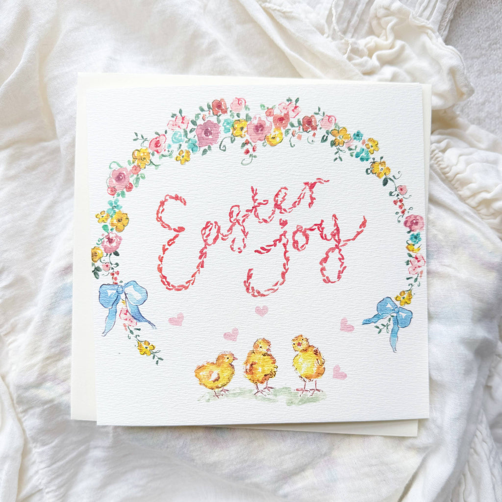 Easter-themed card with chicks, flowers, and 'Easter Joy' text on a white fabric background.