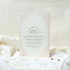 Card with text and floral design on a soft white background