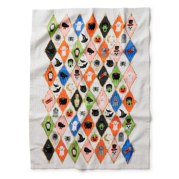 Halloween-themed quilt with diamond pattern on a white background