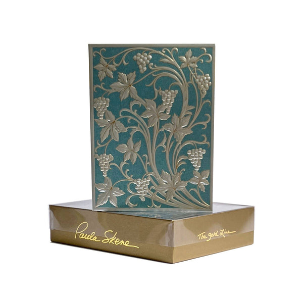 Decorative box with floral and vine design on a white background