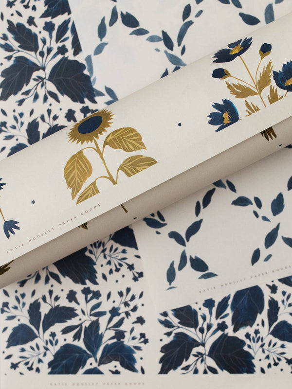Floral patterned paper with gold sunflower design on a white background