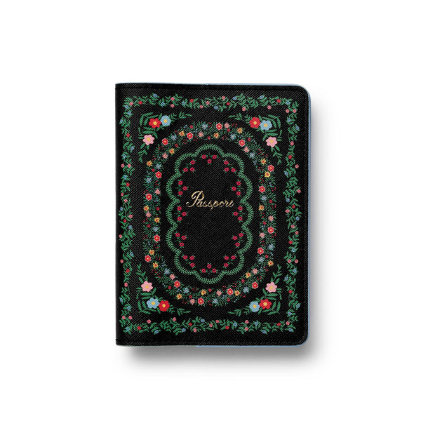 Black passport holder with floral design on a white background