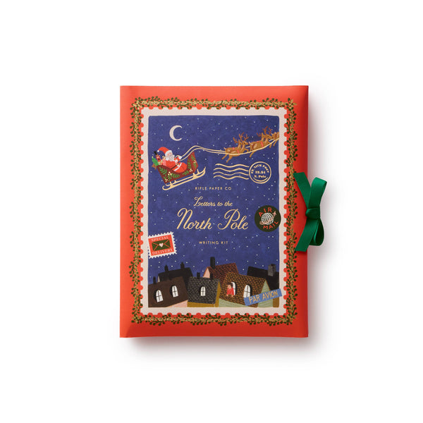 Christmas-themed notepad with Santa Claus illustration on a white background