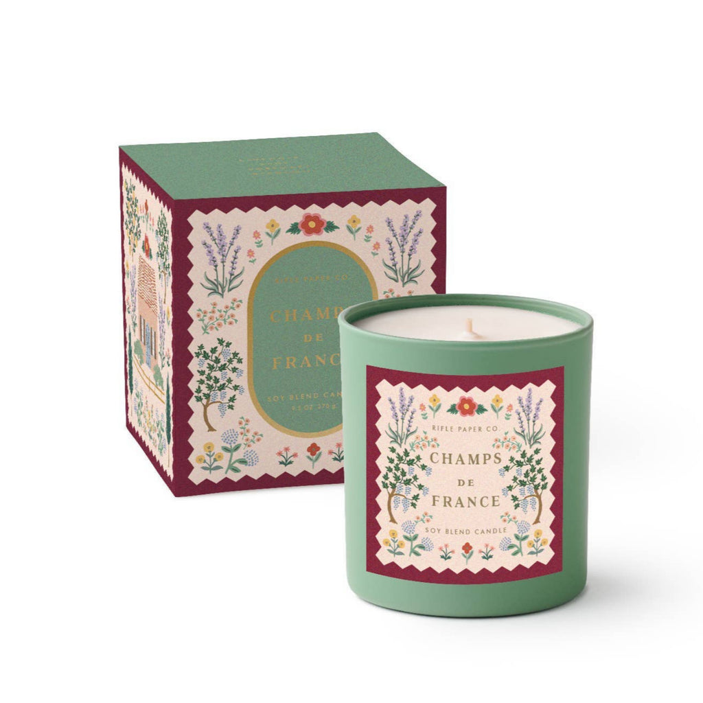 Candle with decorative packaging on a white background