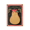 Sticky notes shaped like a pear with a decorative bow on a black background