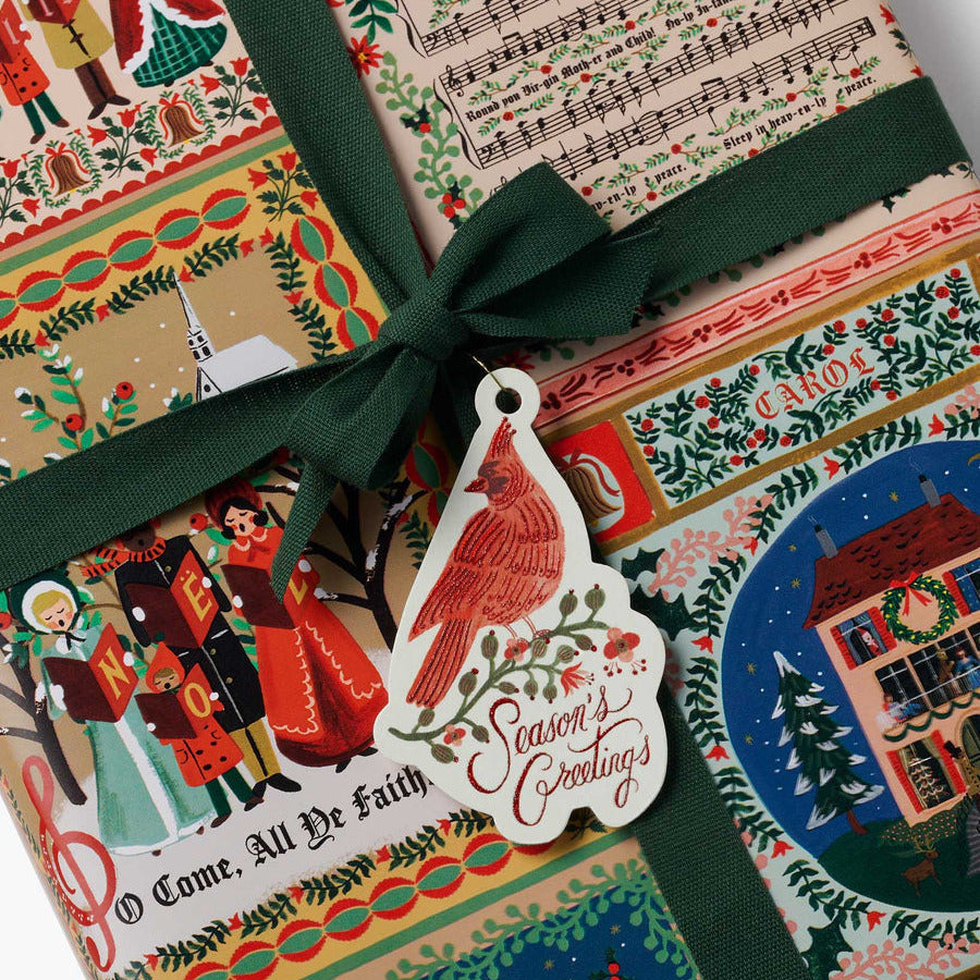 Decorative Christmas gift box with festive design and green ribbon