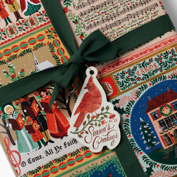 Decorative Christmas gift box with festive design and green ribbon
