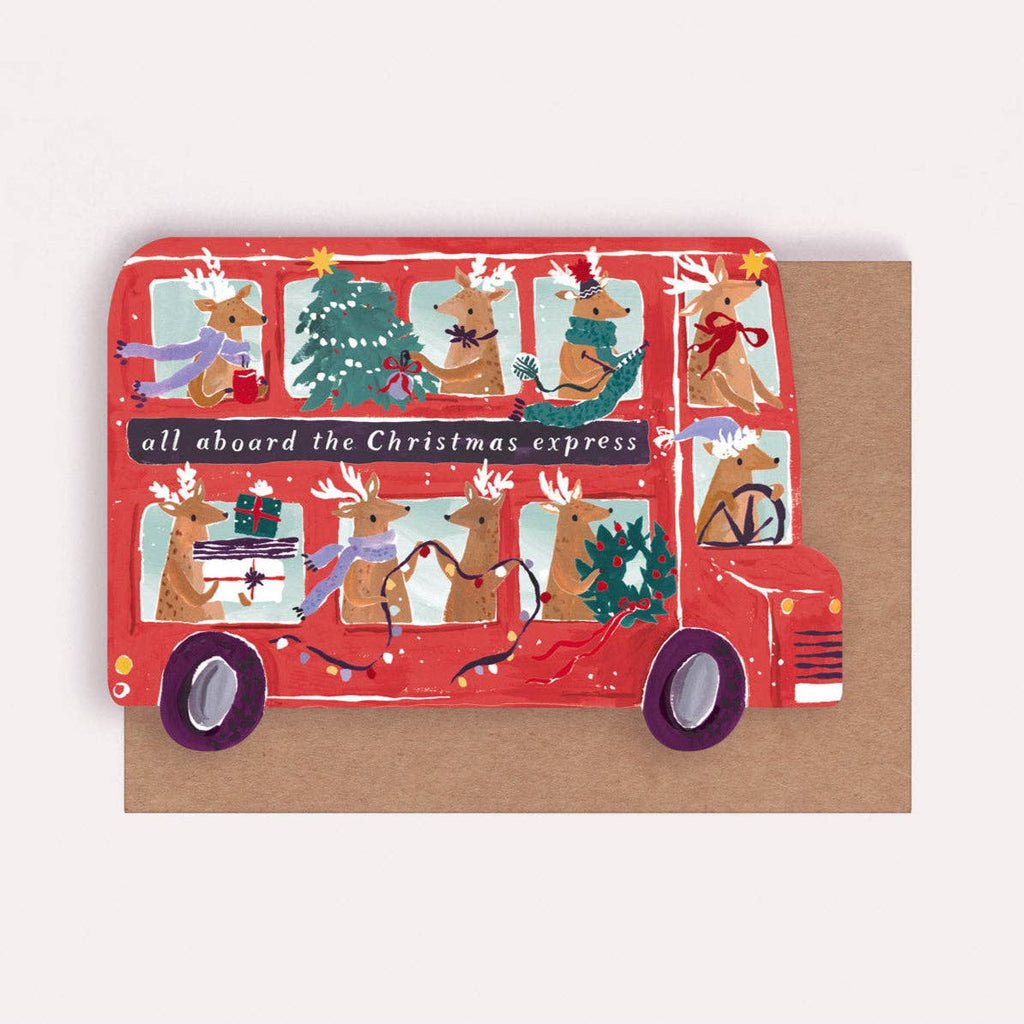 Red Christmas-themed bus with cartoon animals on a brown background
