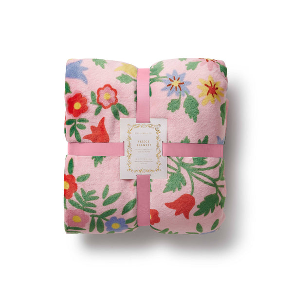 Floral-patterned blanket with pink ribbon on a white background