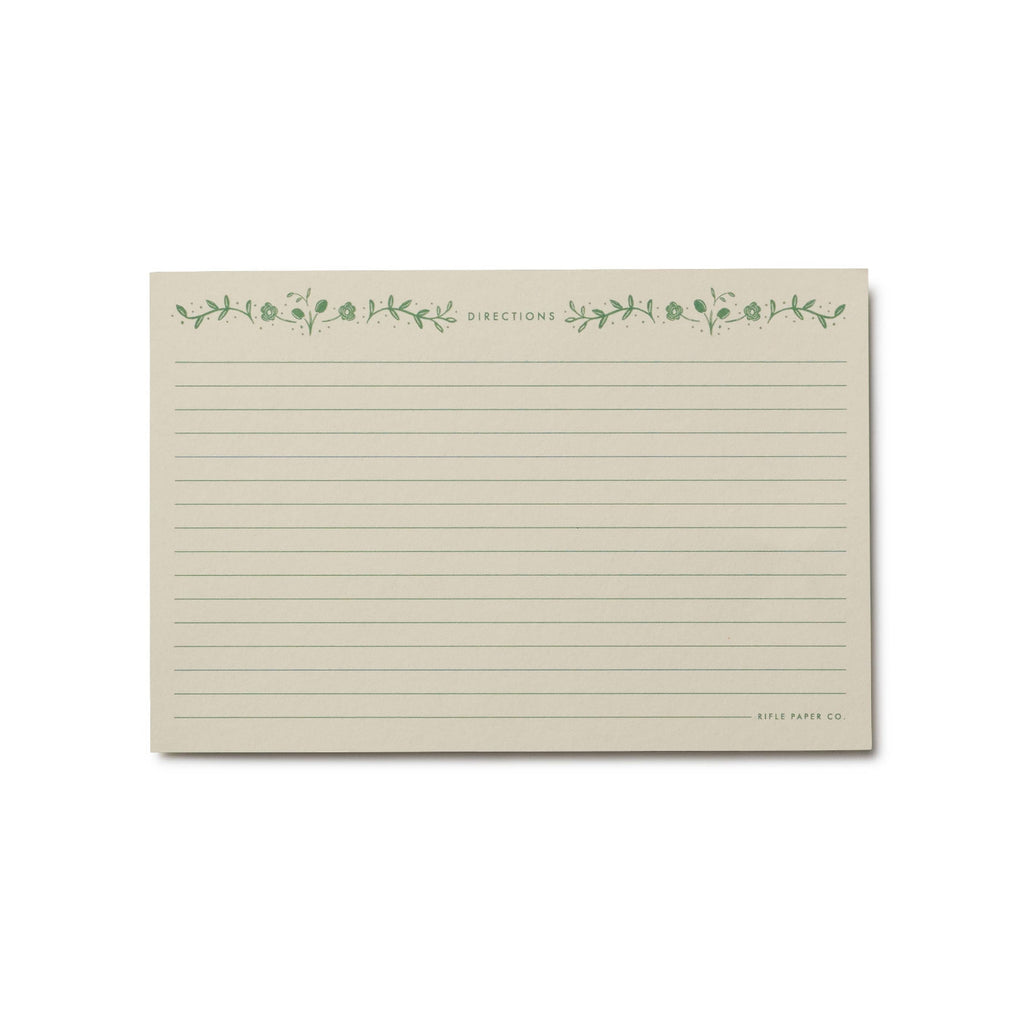 Note card with green floral design and text on a white background