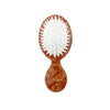 Wooden brush with white bristles on a white background