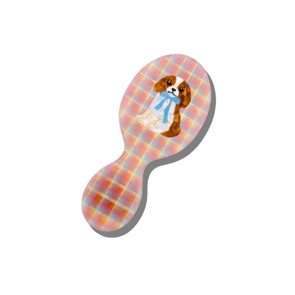 Plaid-patterned hairbrush with a dog design on a white background