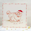 Illustration of a dog wearing a Santa hat on a decorative card with a floral border.
