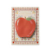 Notebook with a red apple illustration on a decorative cover