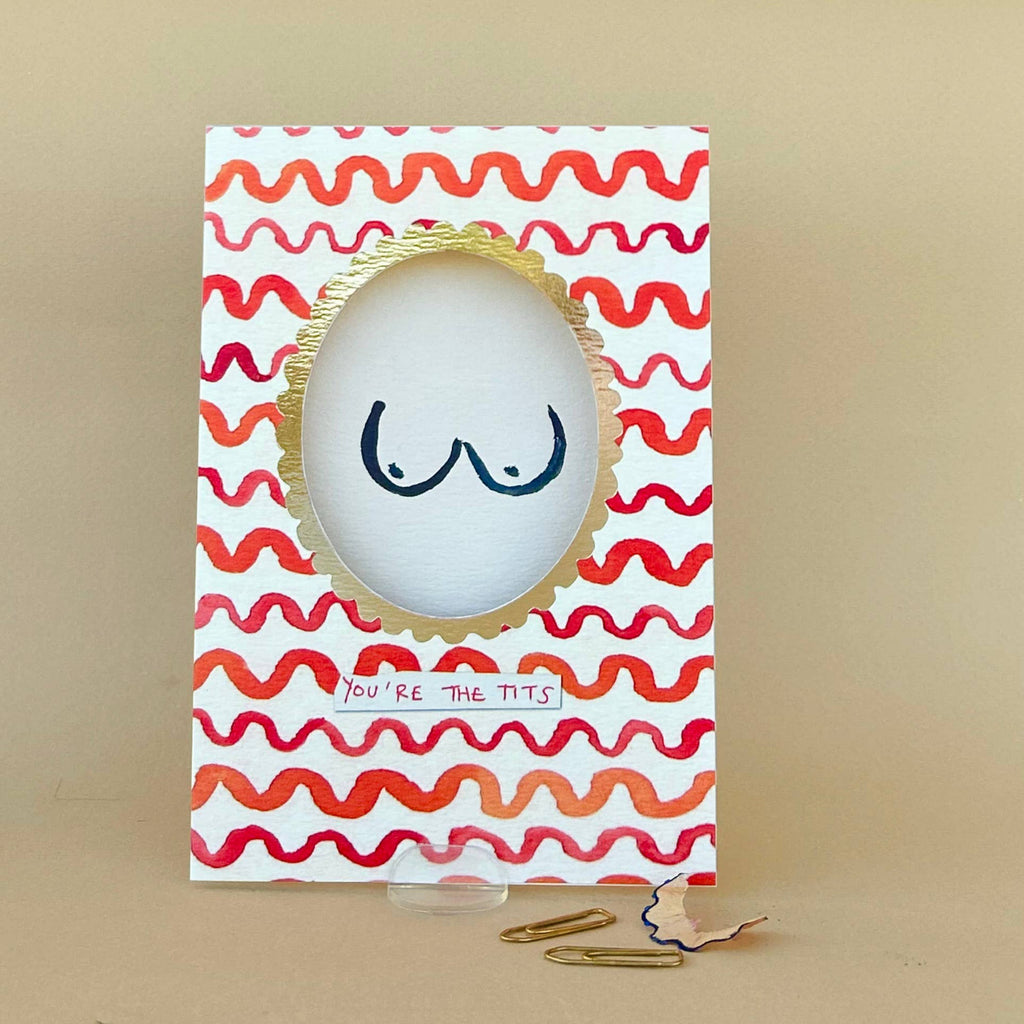 Card with a cartoonish depiction of a face with wavy lines and text on a beige background